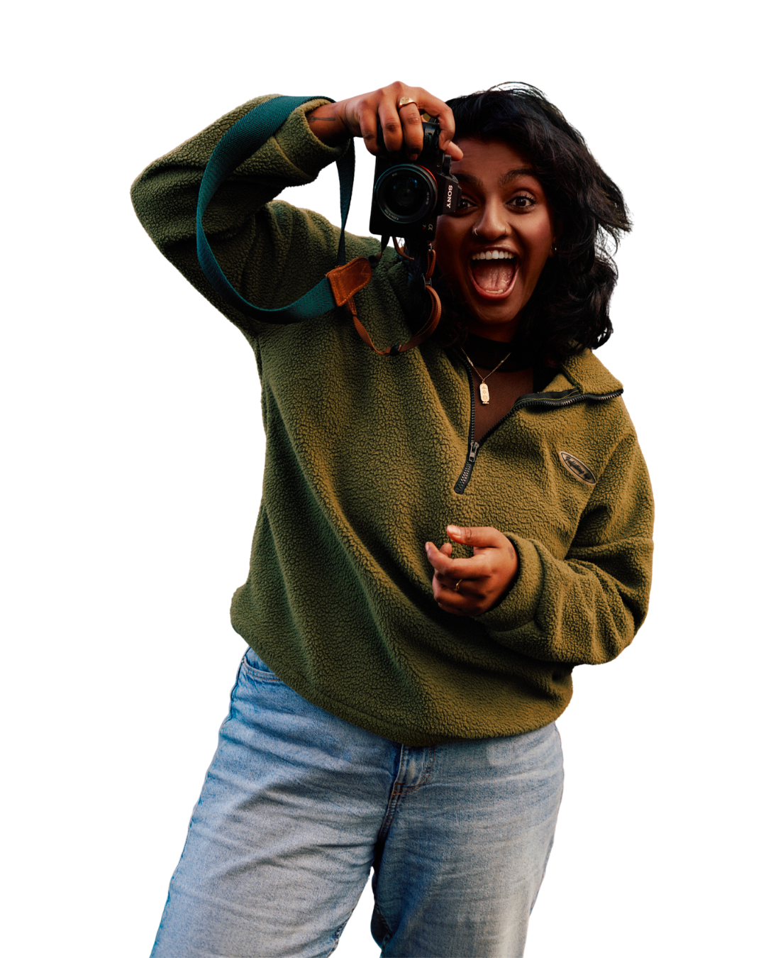 Priya, the photographer behind Puli Creative, holding her camera
